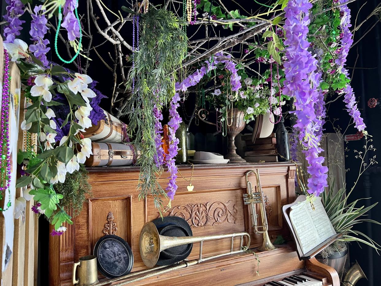 Look up! As guests exit the Mardi Gras Tribute Store, beads hang from a tree in honor of the resort's iconic bead tree. (Photo: Terri Peters)