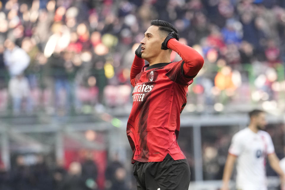 AC Milan's Tijjani Reijnders celebrates after scoring his side's opening goal during a Serie A soccer match between AC Milan and Monza, at the San Siro stadium in Milan, Italy, Sunday, Dec. 17, 2023. (AP Photo/Luca Bruno)