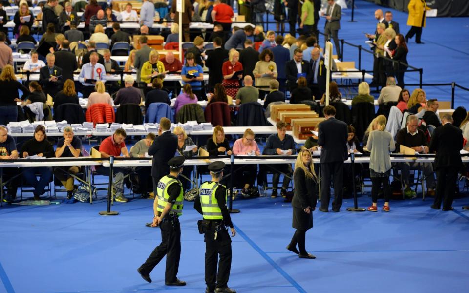 Police officers watch over the UK Parliamentary Elections at the Emirates Arena on June 8, 2017 in Glasgow, Scotland - Credit: Getty