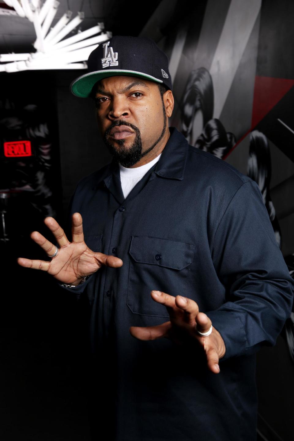 In this Tuesday, Feb. 11, 2014 photo, Ice Cube poses for a portrait in Los Angeles. Ice Cube co-starred with Kevin Hart in the film, "Ride Along," which has made over $134.6 million worldwide. (Photo by Matt Sayles/Invision/AP)