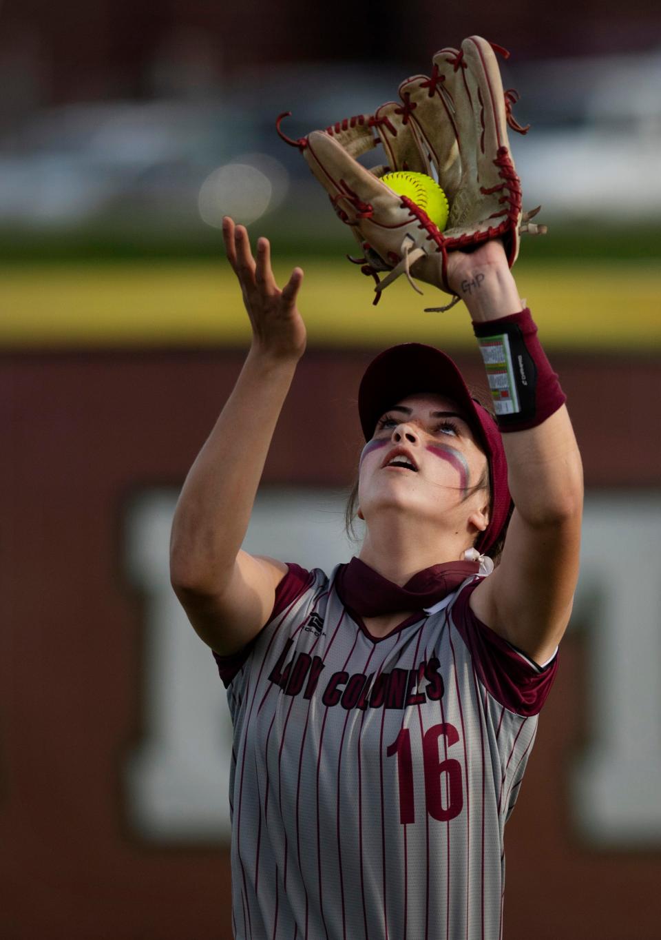 Henderson County's Taylor Troutman (16) hauls in a Castle fly ball at Henderson's North Field Monday evening, April 26, 2021.