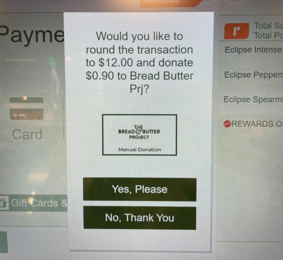 Alert for charity donation request on Woolworths self-serve checkout screen