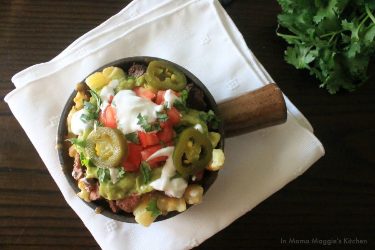 <p>Mama Maggie's Kitchen</p><p><strong>Get the recipe: <a href="https://inmamamaggieskitchen.com/carne-asada-fries" rel="nofollow noopener" target="_blank" data-ylk="slk:Carne Asada Fries;elm:context_link;itc:0;sec:content-canvas" class="link rapid-noclick-resp">Carne Asada Fries</a></strong></p>