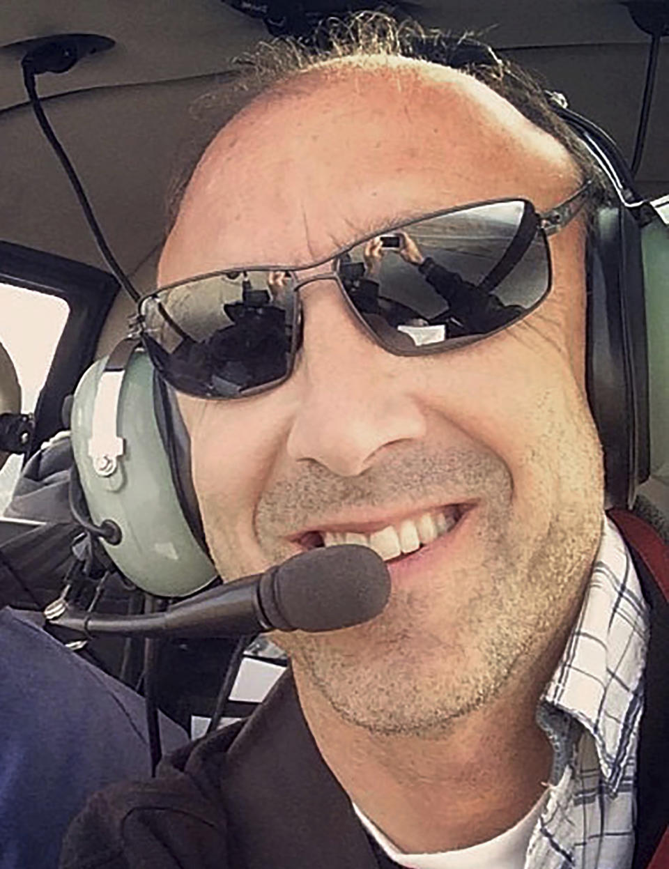 This undated photo provided by Group 3 Aviation shows helicopter pilot Ara Zobayan, who was at the controls of the helicopter that crashed in Southern California, Sunday, Jan. 26, 2020, killing all nine aboard including former Lakers star Kobe Bryant. (Group 3 Aviation via AP)