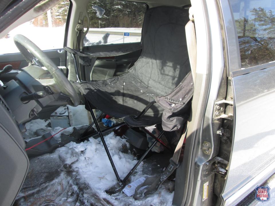 A camper chair pictured in a ute as a substitute for a car seat.