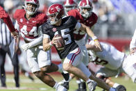 Alabama quarterback Ty Simpson (15) runs the ball during the team's A-Day NCAA college football scrimmage Saturday, April 13, 2024, in Tuscaloosa, Ala. (AP Photo/Vasha Hunt)