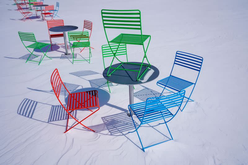 Picnic tables are seen in the snow at Scissortail Park in during record breaking cold weather in Oklahoma City