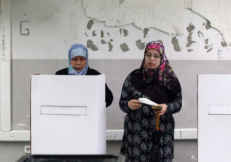 Women prepare to cast their ballots for the presidential election in Skopje, North Macedonia May 5, 2019. REUTERS/Ognen Teofilovski