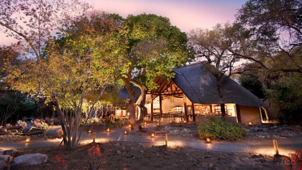 Exterior of the andBeyond Ngala Safari Lodge at night, voted one of the best hotels in the world