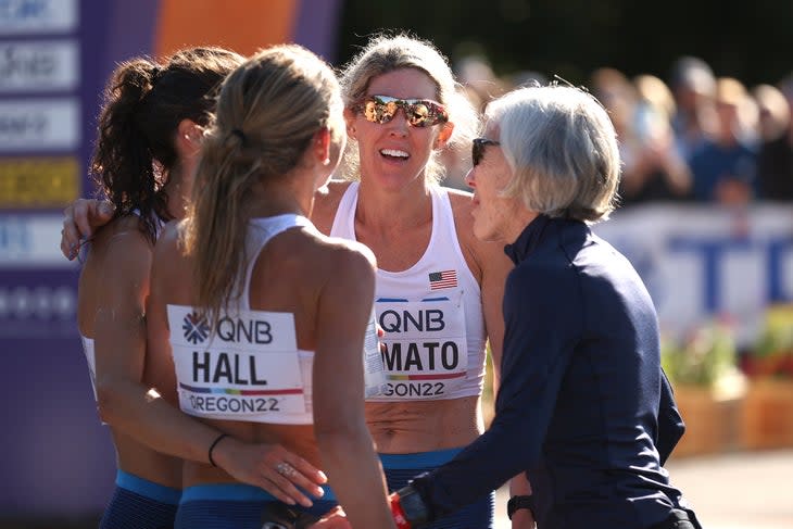 <span class="article__caption">Emma Bates, Sarah Hall, and Keira D’Amato of Team United States talk with Joan Benoit Samuelson at the finish of the Women’s Marathon on day four of the World Athletics Championships Oregon22 at Hayward Field on July 18, 2022 in Eugene, Oregon. </span> (Photo: Ezra Shaw/Getty Images)
