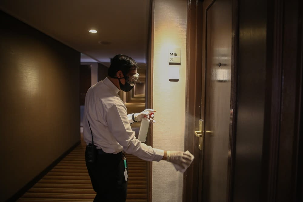 A hotel staff disinfects one of the rooms at the Concorde Hotel in Shah Alam June 9, 2020. — Picture by Yusof Mat Isa