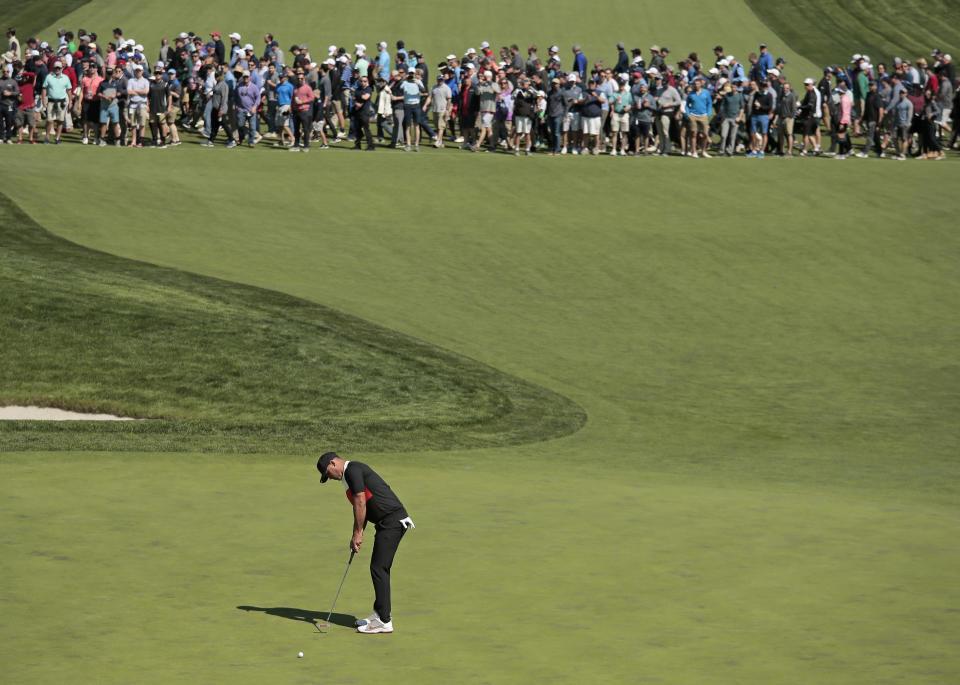 Brooks Koepka putts on the 16th green during the first round of the PGA Championship golf tournament, Thursday, May 16, 2019, at Bethpage Black in Farmingdale, N.Y. (AP Photo/Andres Kudacki)