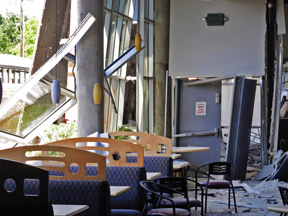 This July 11, 2019 photo shows damage in the first-floor cafeteria at a University of Nevada, Reno dormitory where a July 5 natural gas explosion blew out walls and windows, in Reno, Nev. Argenta Hall and a neighboring dorm will remain closed all school year. With less than six weeks to find rooms for about 1,300 students after a July 5 gas explosion shut down their two biggest residence halls, the university took a lease to turn a Reno casino hotel tower into a college dormitory for a year. (AP Photo/Scott Sonner)