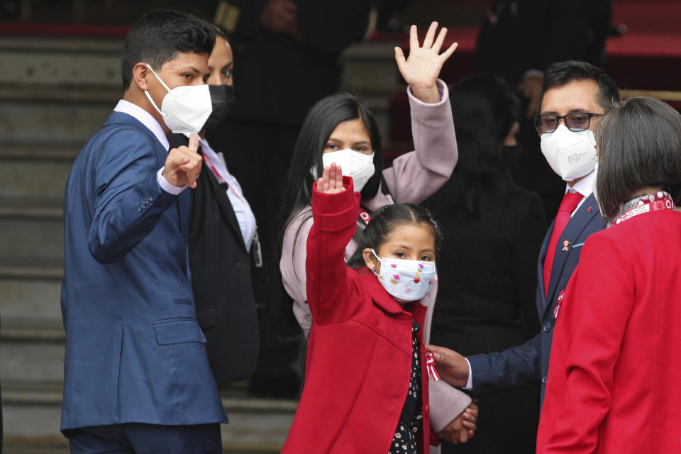 President-elect Pedro Castillo's son Arnold, daughter Alondra, front, and sister-in-law Yenifer Paredes wave as they enter Congress for Castillo's swearing-in ceremony in Lima, Peru, Wednesday, July 28, 2021. (AP Photo/Francisco Rodriguez)