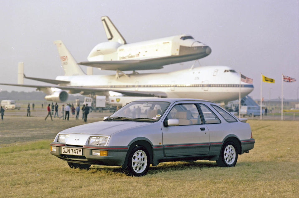 <p>We take it for granted today, but <strong>the Ford Sierra looked otherworldly</strong> when it touched down in 1982. Ford had the tough ask of convincing Cortina owners to jump into the radical new ‘jelly mould’ family car, yet despite early struggles, sales soon took off. Performance versions and success on the track played a part in its eventual rise to greatness.</p>