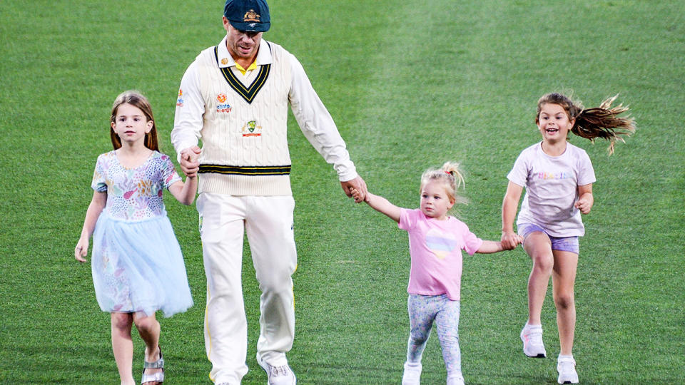 David Warner, pictured here walking off the field with his children after the second Ashes Test.