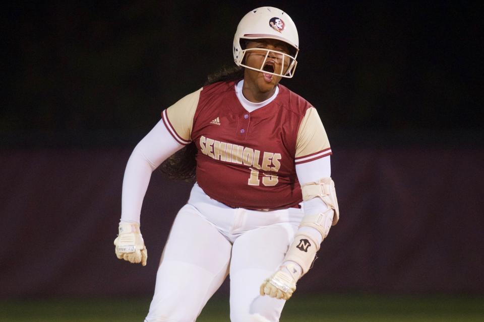 Florida High junior Dillyn Suggs (19) celebrates hitting a double in a game between Florida High and Chiles on March 20, 2023, at Chiles High School. The Seminoles won, 11-2.