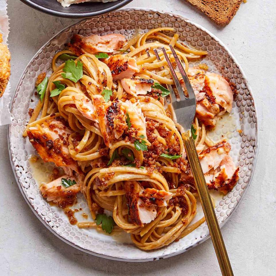 <p>Wondering what to do with leftover salmon? This is a delicious and easy way to turn it into another weeknight-friendly, quick dinner. Don't forget to reserve some pasta water—its starch thickens the lemon-garlic pasta sauce and makes it silky-smooth. <a href="https://www.eatingwell.com/recipe/276373/lemon-garlic-pasta-with-salmon/" rel="nofollow noopener" target="_blank" data-ylk="slk:View Recipe;elm:context_link;itc:0;sec:content-canvas" class="link ">View Recipe</a></p>