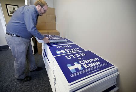 Campaign worker T.J. Elllerbeck gathers signs at the Utah Democratic Party offices in Salt Lake City, Utah, October 12, 2016. REUTERS/George Frey