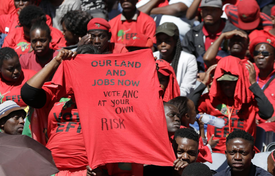 Supporters of the Economic Freedom Fighters (EFF) party attend their election rally at the Orlando Stadium in Soweto, South Africa, Sunday, May 5, 2019, ahead of South Africa's election on May 8. (AP Photo/Themba Hadebe)