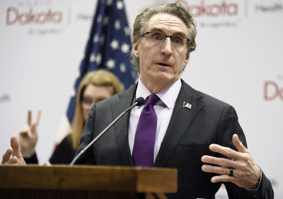 FILE - In this April 10, 2020, file photo, North Dakota Gov. Doug Burgum speaks at the state Capitol in Bismarck, N.D. A Bismarck marketing agency is rolling out a campaign meant to help stem the tide of rising COVID-19 cases in central North Dakota, and it comes at a time when the state leads the nation in cases per capita. Agency MABU was hired by a governor's task force in Burleigh and Morton counties that is nearly six weeks into its effort and frustrated by the lack of progress in the state's virus hotspot. (Mike McCleary/The Bismarck Tribune via AP, File)