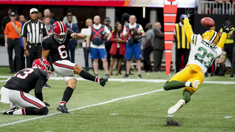 Atlanta Falcons place kicker Younghoe Koo, of South Korea, (6) kicks the game-winning field goal against Green Bay Packers cornerback Jaire Alexander (23) during the second half of an NFL football game, Sunday, Sept. 17, 2023, in Atlanta. The Atlanta Falcons won 25-24. (AP Photo/Brynn Anderson)