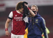 Arsenal's David Luiz holds a towel on a cut to his head following a clash with Wolverhampton Wanderers' Raul Jimenez during the English Premier League soccer match between Arsenal and Wolverhampton Wanderers at Emirates Stadium, London, Sunday, Nov. 29, 2020. (John Walton/Pool via AP)