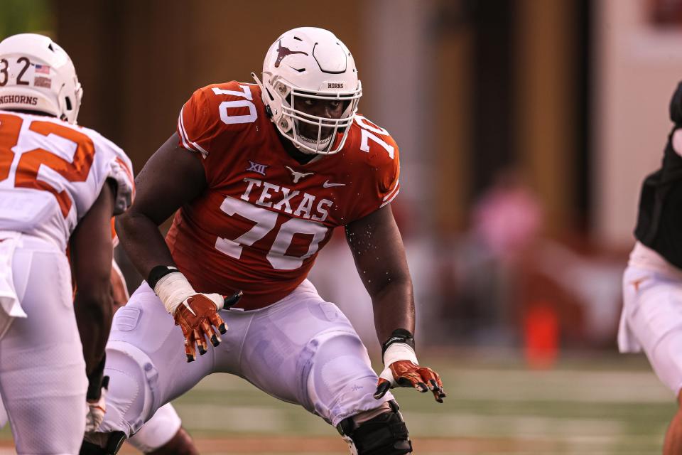 Texas offensive lineman Christian Jones (70) reacts to the snap during Texas's annual spring football game at Royal Memorial Stadium in Austin, Texas on April 23, 2022.