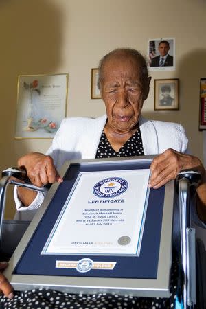 Susannah Mushatt Jones is pictured with a certificate from Guinness World Records proclaiming her as the world's oldest woman in New York in this July 3, 2015 handout photo obtained by Reuters July 6, 2015. REUTERS/Philip Robertson/Guinness World Records/Handout via Reuters