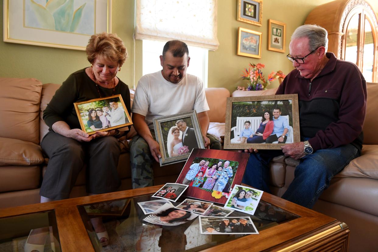 Judy Gorcey, left, son-in-law Moises Espinoza and her husband, David Gorcey, held family photos that include the Gorceys' daughter during a 2023 interview. Megan Espinoza died in 2019 after a cardiac arrest during plastic surgery. The doctor pleaded guilty Monday to voluntary manslaughter. ANTHONY PLASCENCIA/THE STAR