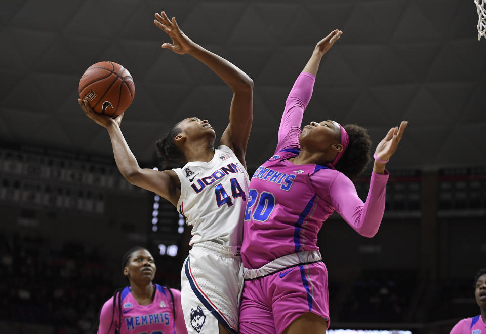 Connecticut's Aubrey Griffin, front left, shoots as Memphis' Keke Hunter defends in the first half of an NCAA college basketball game, Friday, Feb. 7, 2020, in Storrs, Conn. (AP Photo/Jessica Hill)