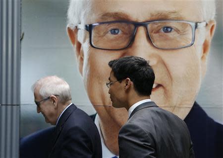 German Economy minister Philipp Roesler (R) chairman of the liberal Free Democratic Party (FDP) and the FDP's top candidate Rainer Bruederle leave after a news conference following a FDP board meeting in Berlin, September 16, 2013. REUTERS/Fabrizio Bensch