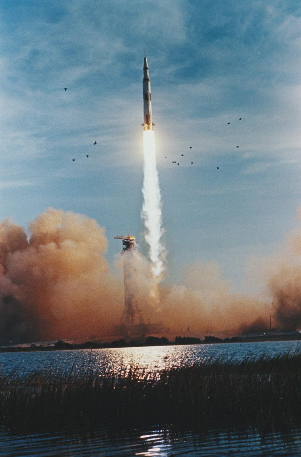 The giant Saturn V rocket exploding out