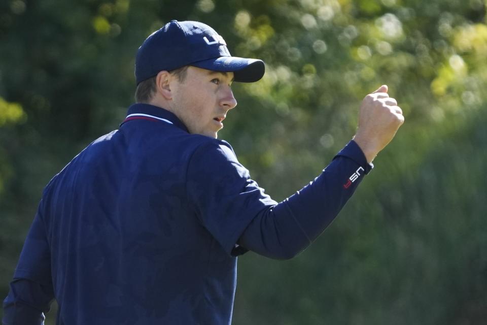 Team USA's Jordan Spieth reacts after making a putt on the ninth hole during a foursomes match the Ryder Cup at the Whistling Straits Golf Course Saturday, Sept. 25, 2021, in Sheboygan, Wis. (AP Photo/Charlie Neibergall)