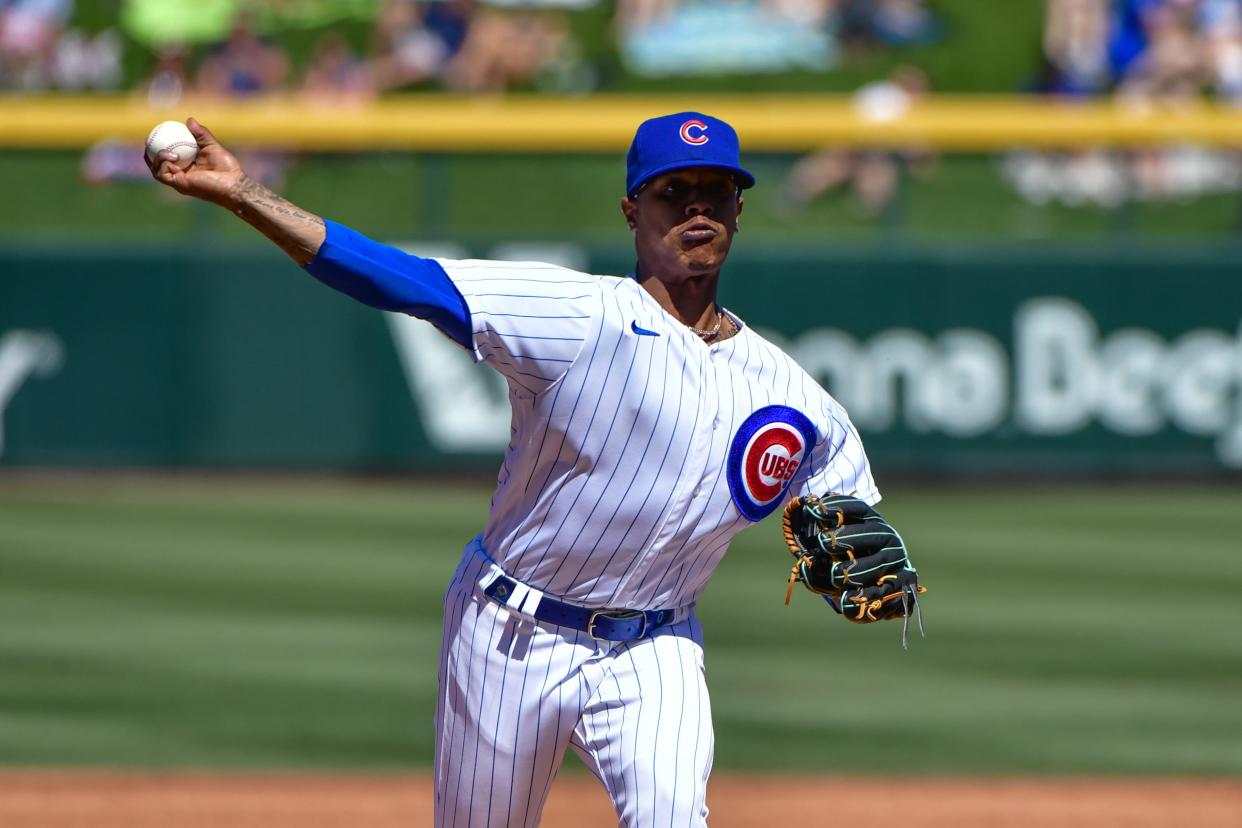 Chicago Cubs starting pitcher Marcus Stroman throws in the second inning against the Oakland Athletics during spring training.
