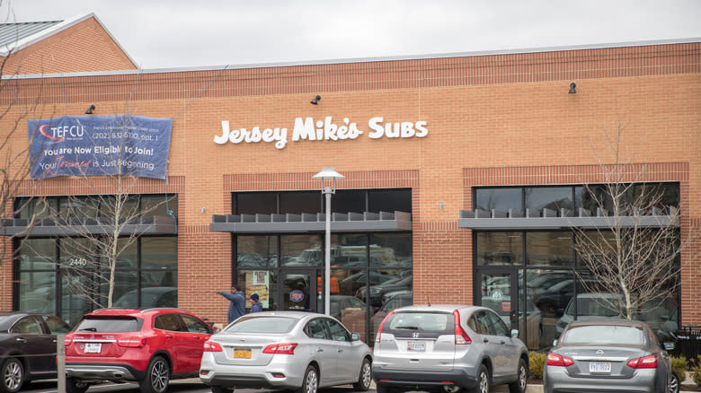 Jersey Mike's storefront with cars