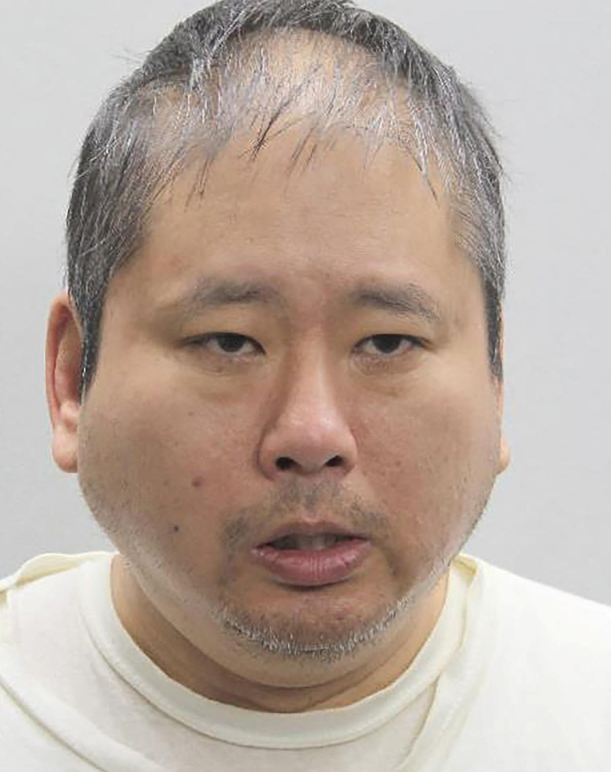 Xuan Kha Tran Pham, 49, appears in a booking photograph after his arrest on suspicion of attacking two staff members in Rep. Gerry Connolly's district office in Fairfax, Va., Monday. 