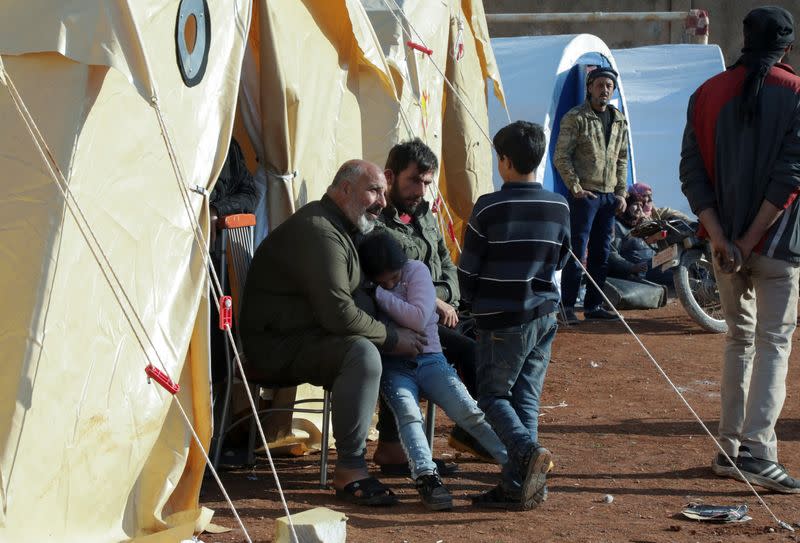 Earthquake survivor, Sabri Al Salameh, 59, sits near tents in the rebel-held town of Harem