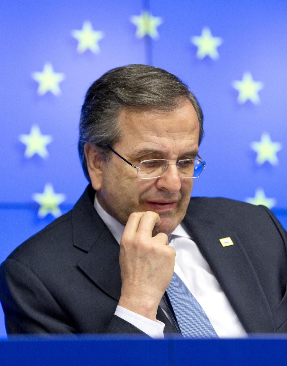 Greek Prime Minister Antonis Samaras pauses before speaking during a media conference at an EU summit in Brussels on Thursday, March 20, 2014. The EU Commission president wants a two-day summit of European Union leaders to center on boosting the fledgling government in Kiev rather than focus exclusively on sanctions against Russia over its annexation of Ukraine’s Crimea peninsula. EU Commission President Jose Manuel Barroso said Thursday the 28 nations need to bolster the new authorities in Ukraine with political commitments and economic aid. (AP Photo/Virginia Mayo)