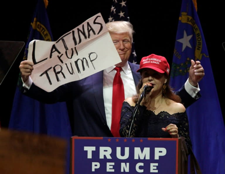 A supporter speaks on stage with Republican presidential candidate Donald Trump during a campaign rally at the Venetian Hotel on October 30, 2016 in Las Vegas, Nevada