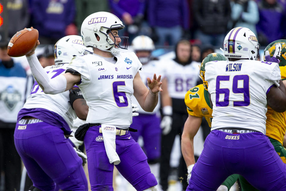 James Madison quarterback Ben DiNucci (6) looks to pass during the first half of the FCS championship NCAA college football game against North Dakota State, Saturday, Jan. 11, 2020, in Frisco, Texas. (AP Photo/Sam Hodde)