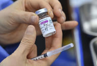 A nurse prepares to administer a dose of the AstraZeneca COVID-19 vaccine at a health care centre in Seoul Friday, Feb. 26, 2021. South Korea on Friday administered its first available shots of coronavirus vaccines to people at long-term care facilities, launching a mass immunization campaign that health authorities hope will restore some level of normalcy by the end of the year. (Jung Yeon-je /Pool Photo via AP)