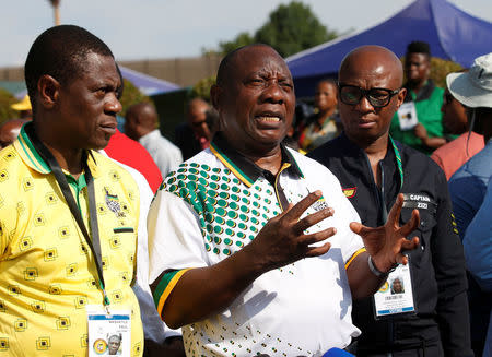 FILE PHOTO: President of the African National Congress (ANC) Cyril Ramaphosa with the deputy president David Mabuza and spokesman Zizi Kodwa address the media at the Nasrec Expo Centre where the 54th National Conference of the ruling party is taking place in Johannesburg, South Africa December 19, 2017. REUTERS/Rogan Ward/File Photo