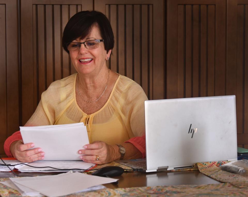 Rhonda McCarthy, a former VE teacher at Quest Elementary School in Viera, pictured catching up on work after school at her home.