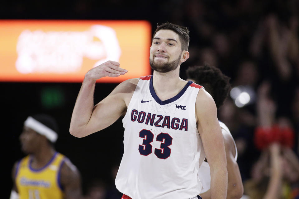 Gonzaga forward Killian Tillie (33) gestures after scoring a three-point basket during the first half of an NCAA college basketball game against Cal State Bakersfield in Spokane, Wash., Saturday, Nov. 23, 2019. (AP Photo/Young Kwak)