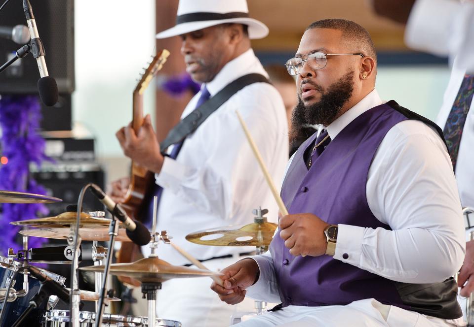 The Breeze Band guitarist Kenny Hollis, left, and drummer Clarence Jennings Jr. perform during ErieBank 8 Great Tuesdays on July 20, 2021, at the Highmark Amphitheater in Erie. The Breeze Band will perform at Franklin Park, East Seventh Street and Marne Road, on July 17 as part of the 814 Concert Series.