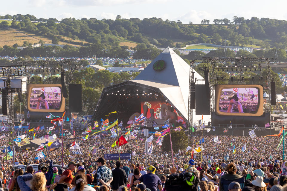 The crowd gathers to watch Elton John perform on the main Pyramid Stage on Day 5 of the Glastonbury Festival 2023. (Getty)