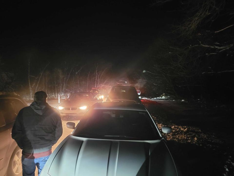 A man looks on helplessly outside of Nikki Haley’s event in Adel, Iowa, as two lines of unmoving vehicles block people from leaving or arriving (John Bowden)