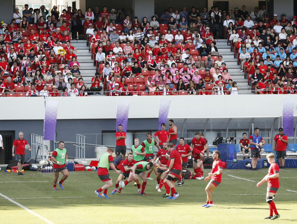 Wales' rugby team players work out in front of the spectators in Kitakyushu, western Japan, Monday, Sept. 16, 2019, ahead of the Rugby World Cup in Japan. (Kyodo News via AP)