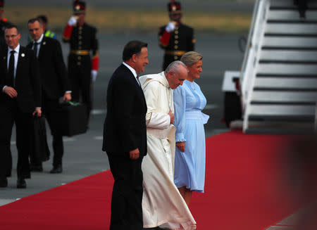 Pope Francis is welcomed by Panama President Juan Carlos Varela and First Lady Lorena Castillo as he arrives at Tocumen International airport for World Youth Day in Panama City, Panama January 23, 2019. REUTERS/Carlos Jasso